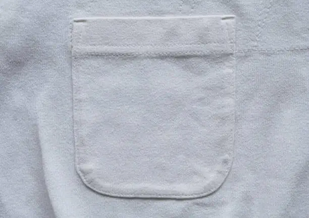Photo of closeup pocket on white cotton shirt