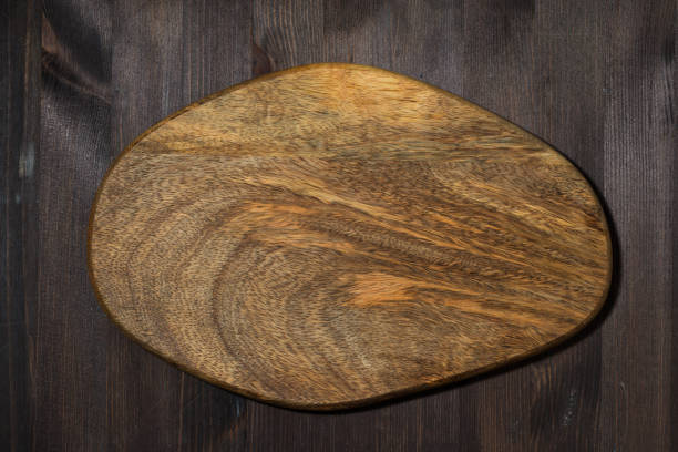istock wooden cutting board as background for design 1172683367