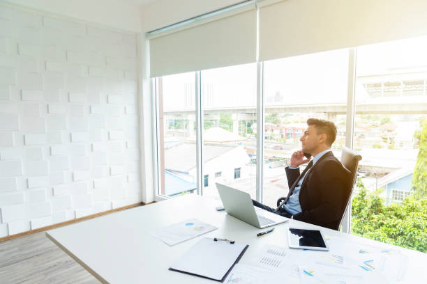 istock Smart businessman using mobile to contact to people in office. Working in modern office with wireless technology. 1172685247
