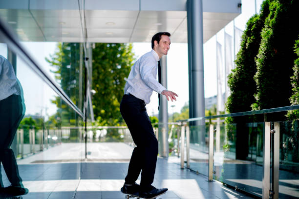 istock Businessman skateboarding 1172686983