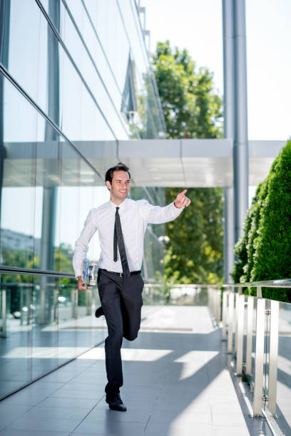 istock Young businessman with skateboard 1172688367