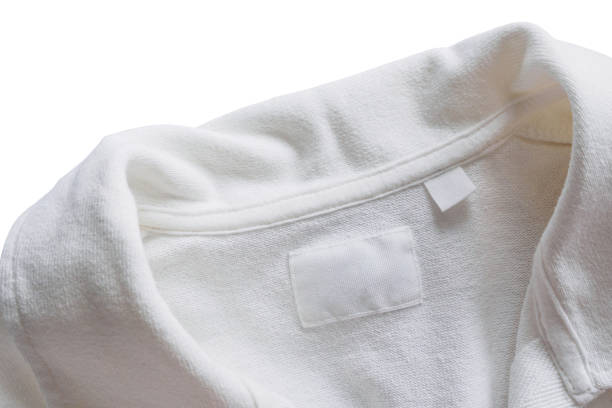 istock Blank white clothes label on new cotton shirt background 1172688632