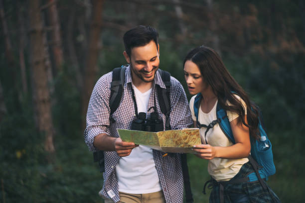 istock Happy couple is hiking in forest. 1172689772