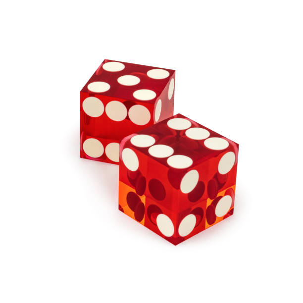 istock Two red professional game dice closeup isolated on a white background / five and six with a light shadow. 1172692853