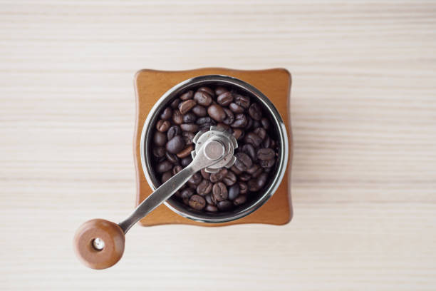 istock Vintage manual coffee grinder with roasted coffee beans 1172693901
