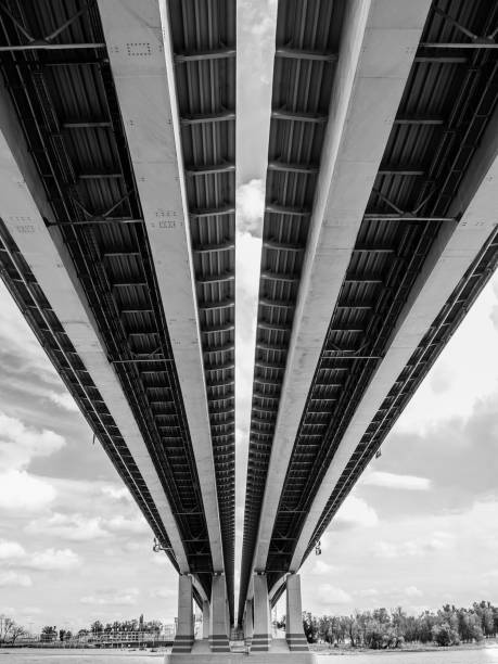 istock bridge bottom view - architecture, abstract background, black and white photo 1172697063