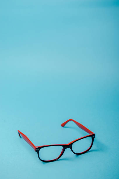 pair of red plastic-rimmed eyeglasses