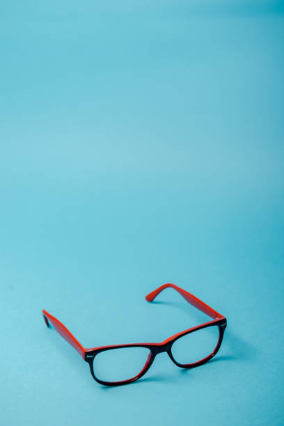 pair of red plastic-rimmed eyeglasses stock photo