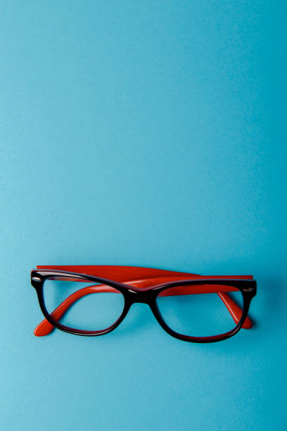istock pair of red plastic-rimmed eyeglasses 1172697172