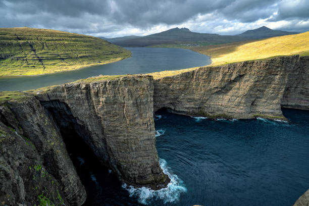istock Sorvagsvatn (or Leitisvatn) infinity lake over the ocean, Faroe Islands. 1172697339