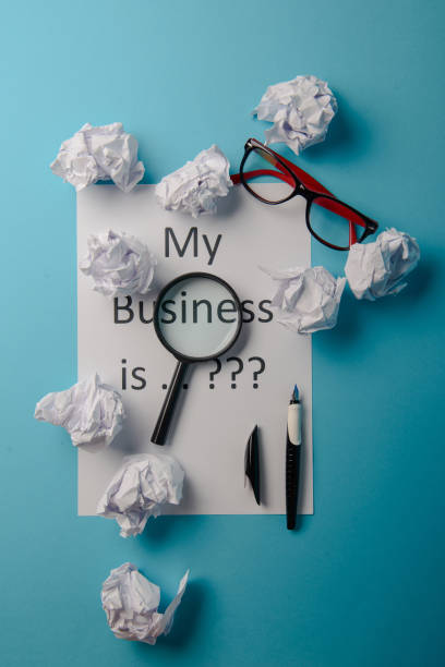 istock Business word with business document paper on blue background 1172697418