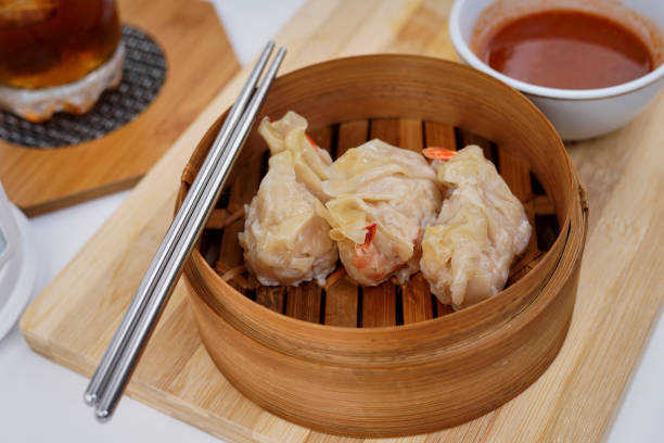 istock Chinese Dim sum in a bamboo steamer with white background 1172701466