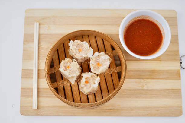 istock Chinese Dim sum in a bamboo steamer with white background 1172701542