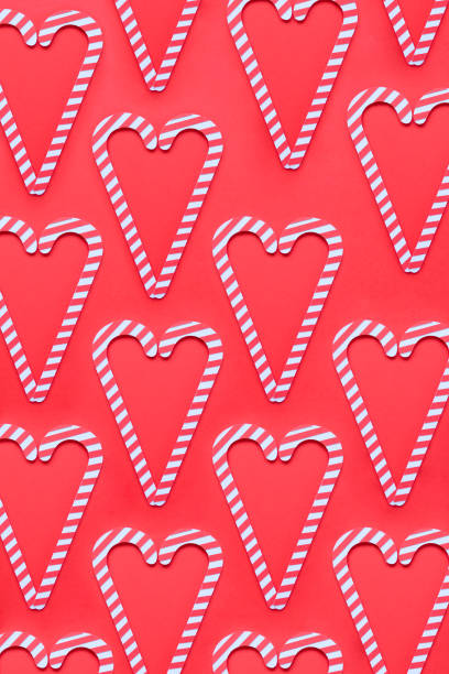 istock Christmas seamless pattern. Red colors. Candy canes and on red background 1172707928