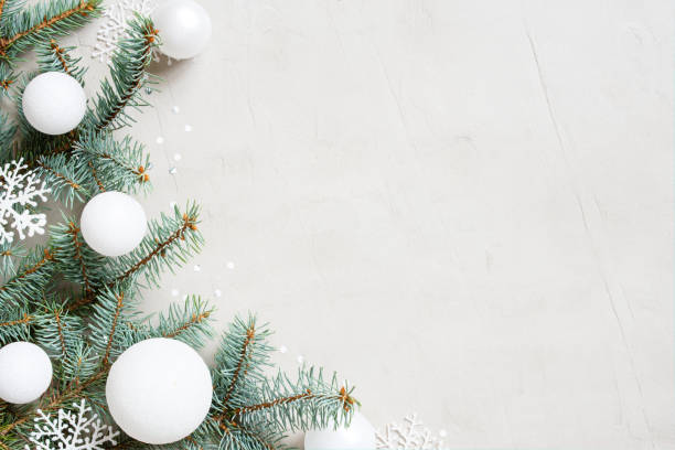 istock White Christmas background with Christmas tree branches, snowflakes and balls 1172710522