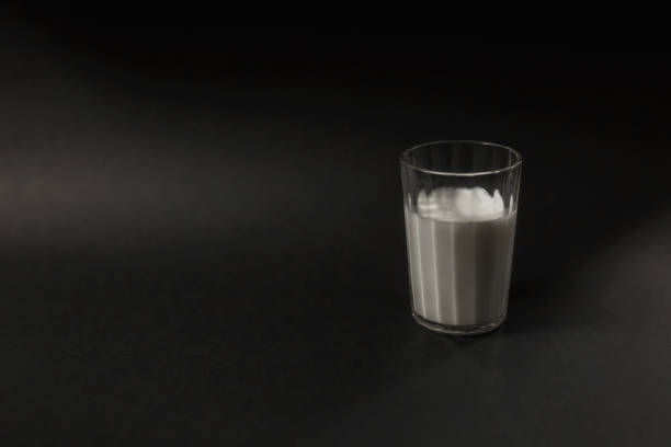 istock a glass of milk is placed on a black background 1172711276