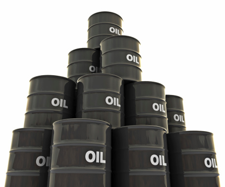 A big group of oil drums stacked on top of each other, isolated on a white background.