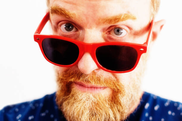 istock Bearded middle-aged man in red sunglasses 1172713171