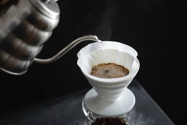 istock Coffee, black coffee, drip coffee, making coffee in low-light 1172715401