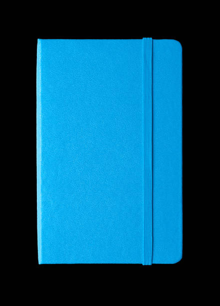 istock Cyan blue closed notebook isolated on black 1172717043