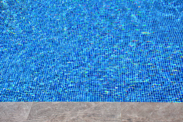 istock Clear water in blue tiled swimming poo 1172719465
