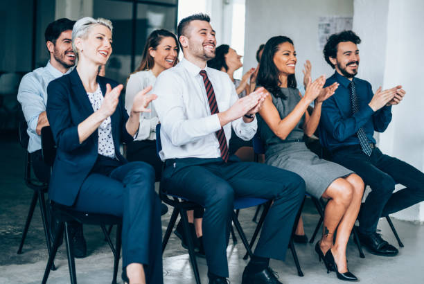 istock Audience Applauding Speaker At Business Conference 1172722076