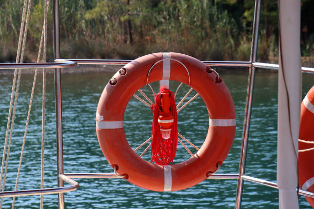 łódź i boja życia - life jacket buoy sign sky zdjęcia i obrazy z banku zdjęć
