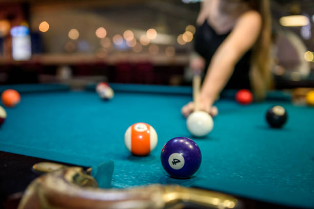 Selective focus at billiard ball on blue table Selective focus at billiard ball on blue table pool break stock pictures, royalty-free photos & images