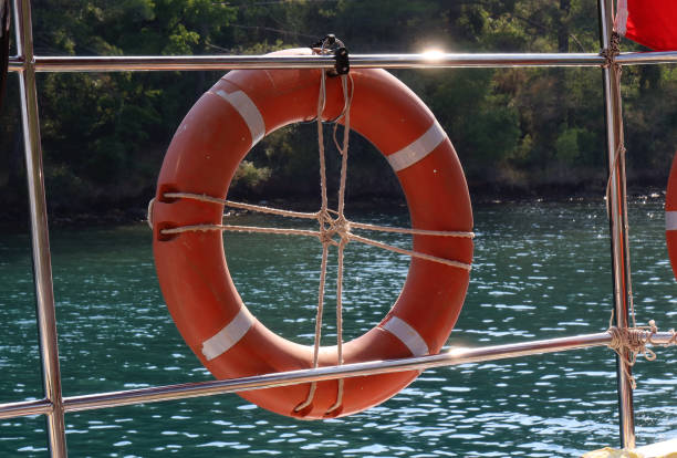 łódź i boja życia - life jacket buoy sign sky zdjęcia i obrazy z banku zdjęć