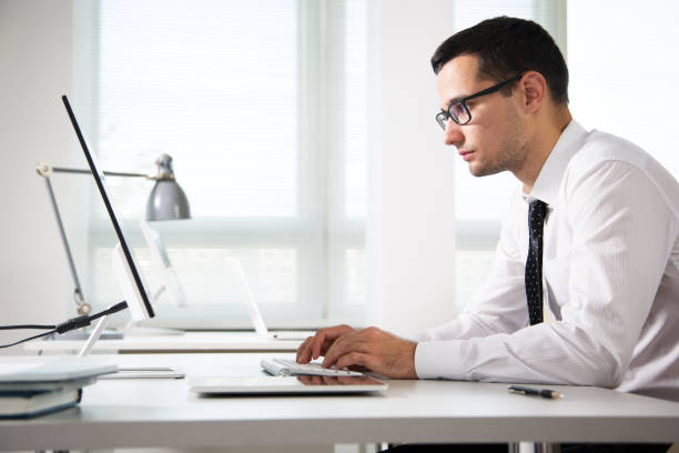 istock Young handsome businessman working in an office 1172728040