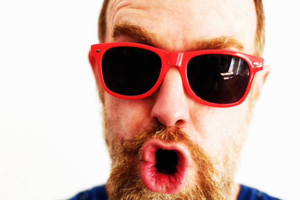 istock Bearded middle-aged man in red sunglasses 1172728574