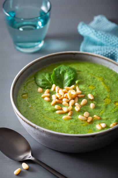 istock green creamy cauliflower spinach soup on gray background 1172729237