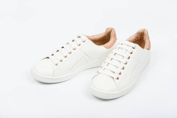 istock Women's sport leather shoes on white background 1172729401
