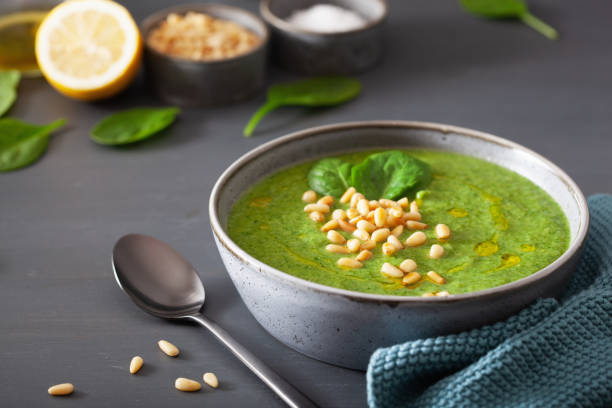 istock green creamy cauliflower spinach soup on gray background 1172729514