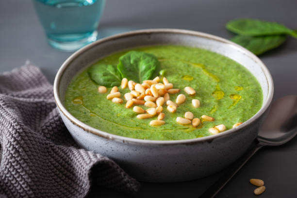 istock green creamy cauliflower spinach soup on gray background 1172729920