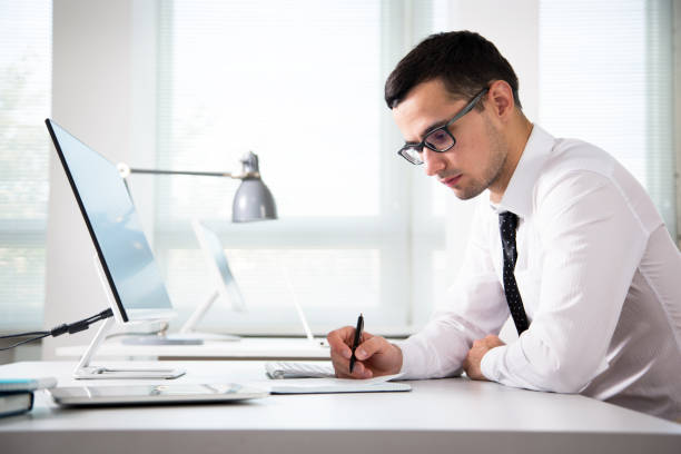 istock Young handsome businessman working in an office 1172730026
