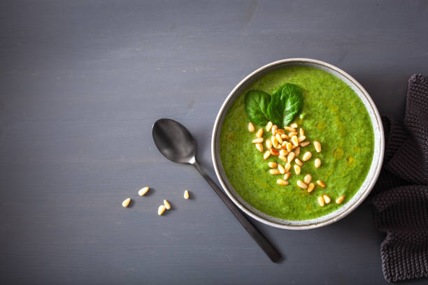 istock green creamy cauliflower spinach soup on gray background 1172730333