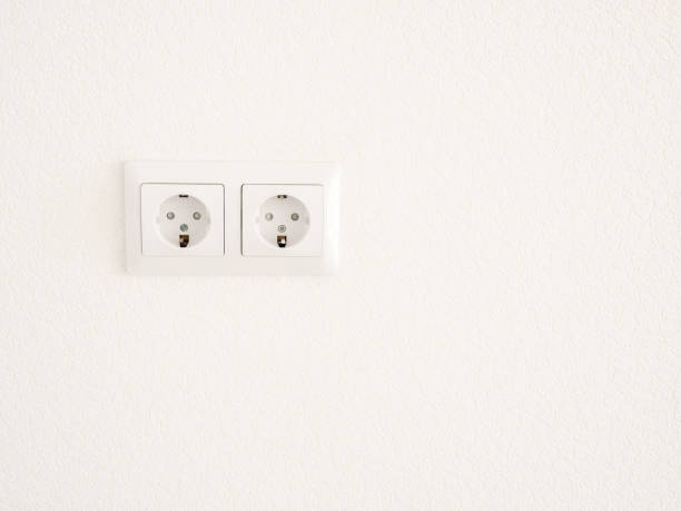 istock Modern white double socket on the wall. Household electrical equipment. 1172731331