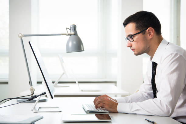 istock Young handsome businessman working in an office 1172731683