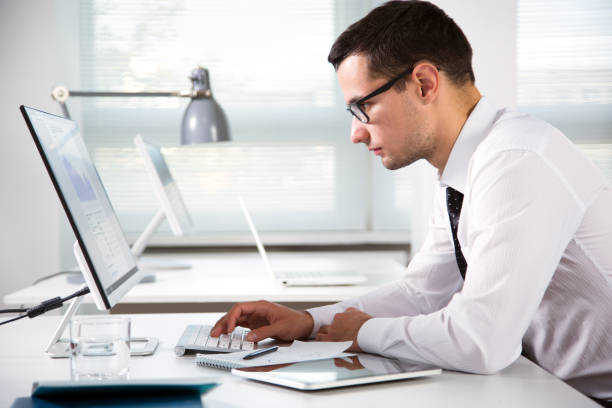 istock Young handsome businessman working in an office 1172731777