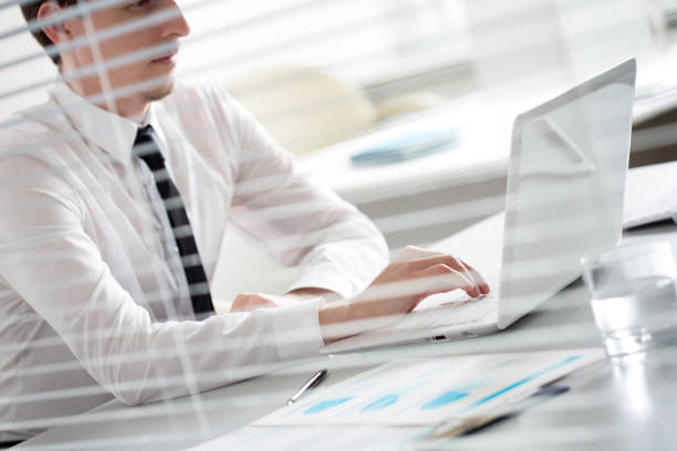 istock Closeup of businessman typing on laptop computer 1172731897