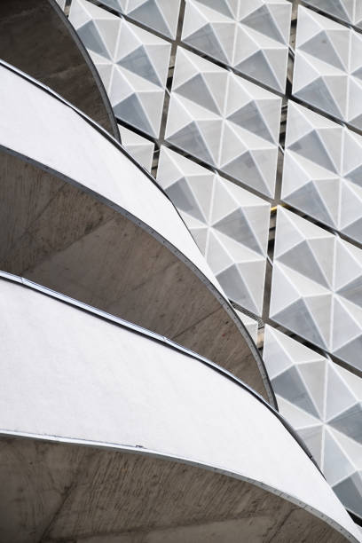 istock Modern office building with angular / rhombus structure of cells. Reworked abstract architecture photo. 1172733873