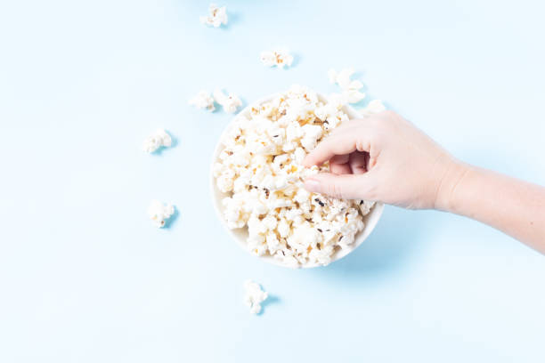 istock Scattered popcorn over yellow background 1172734275