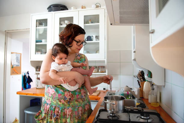 istock Single mother preparing lunch for her family 1172735356