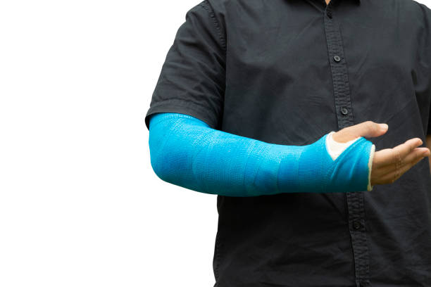istock man holding hand with blue bandage isolate on white background as arm injury concept. 1172739573