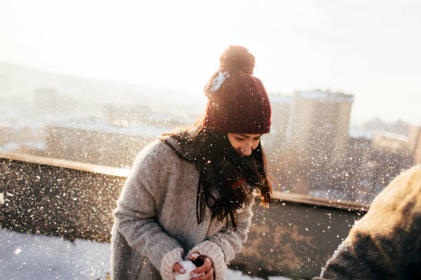 istock Snowball fight on the rooftop 1172741194