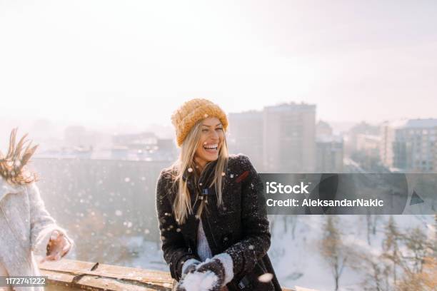 Young Woman Enjoys Snowy Winter Stock Photo - Download Image Now - Winter, Christmas, Snow
