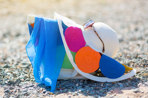 istock Women's hat bag and glasses on the beach. 1172741585