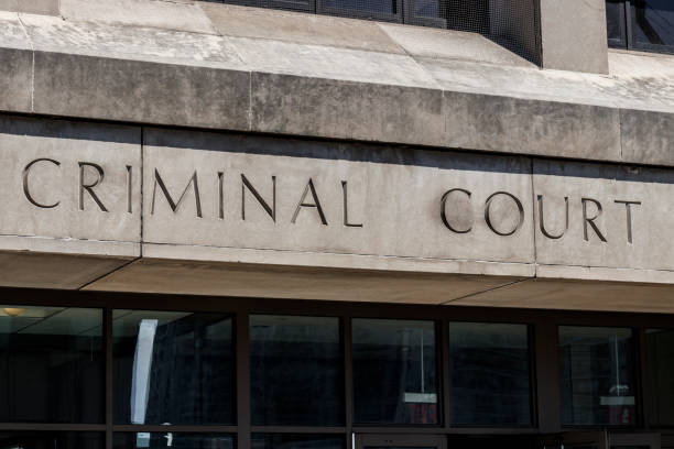 istock Criminal Court letters in a cement facade I 1172741793