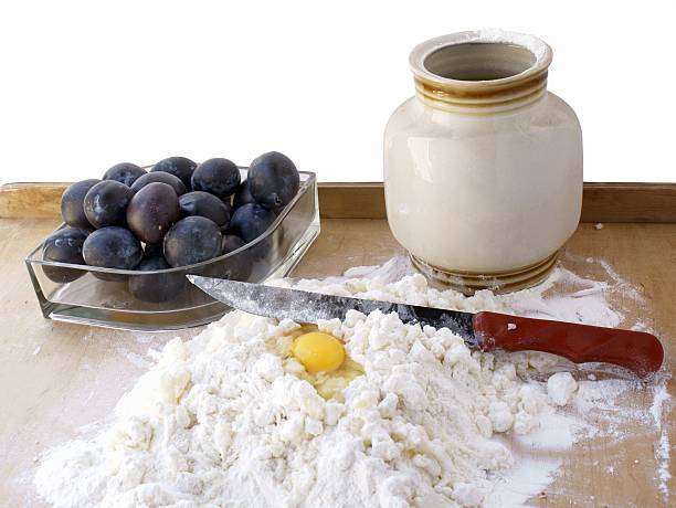 cooking tasty potato dumplings with plums